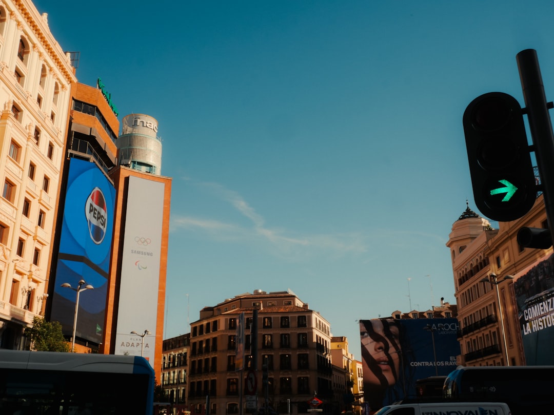 green-traffic-light-with-city-buildings-and-blue-sky-hgmjd3p9hcu